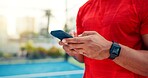 Hands, man and typing with phone on tennis court with fitness app, training tips and track progress. Person, mobile and reservation for padel, technique and video demonstration for sports tournament