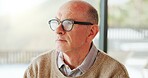 Thinking, glasses and mature man in home with nostalgia, memory or reflection in morning. Planning, ideas and male person relax in living room with decision, choice or mindfulness in apartment.