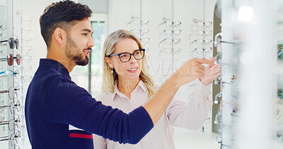 Buy stock photo Health, man and shopping for glasses with optometrist, vision and assist with choice. Store, eyewear and person with optician for help, optometry or happy client with prescription lens for eye care