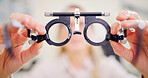 Eyesight test, hands and optometry with person in office for assessment or prescription frame lenses. Eye exam, healthcare and phoropter with doctor in ophthalmology clinic for vision correction