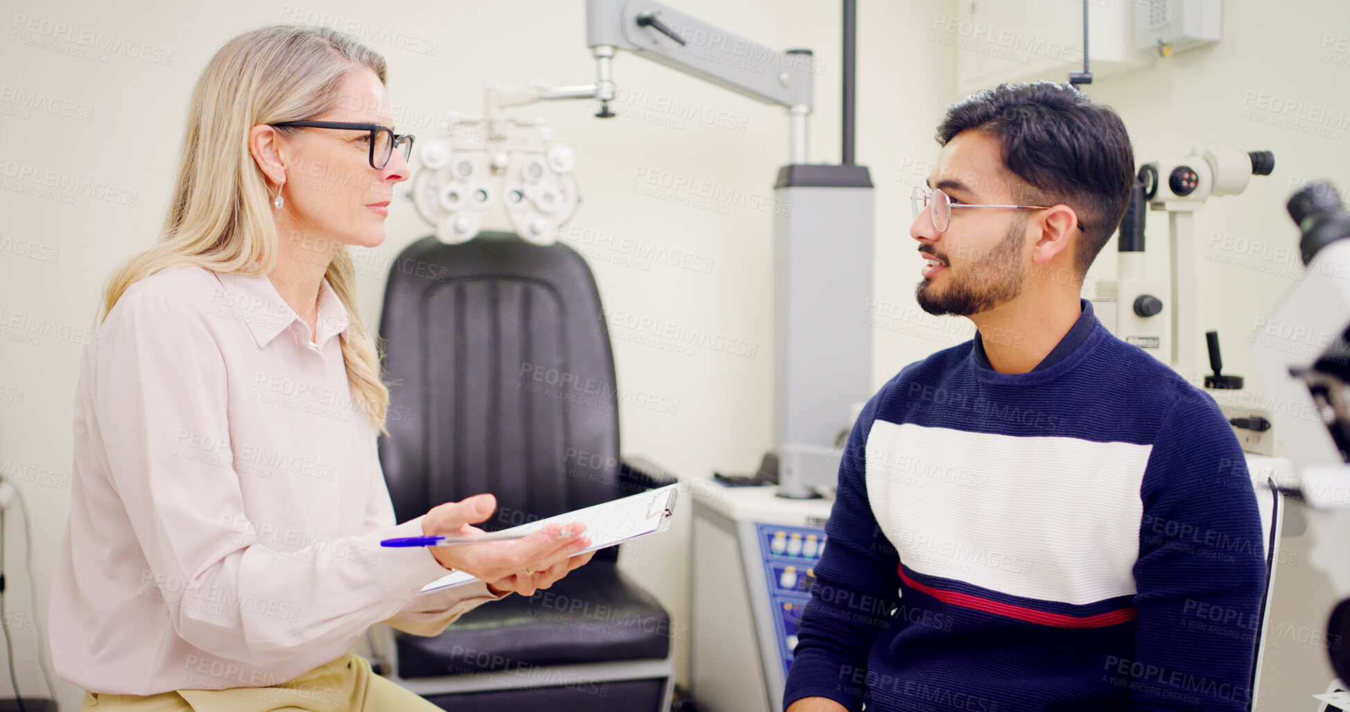 Buy stock photo People, optometrist and clipboard for checkup in office with questions, eye exam and prescription. Man, ophthalmologist and checklist with medical record, patient evaluation and symptoms for eyesight