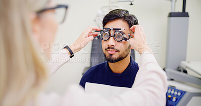 Buy stock photo Optometrist, man or trial lens frame for eye exam, vision assessment or consultation for clear sight. Client testing, optometry or people with tool to determine prescription, iris health or clinic