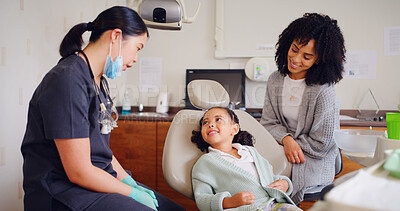 Buy stock photo Child, smile and dentist for consultation with discussion, oral hygiene and mouth cleaning service. Mother, health professional and orthodontic inspection for dental care with girl for checkup