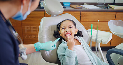 Buy stock photo Happy, child and consultation with dentist in office for dental checkup, show cavity and extraction. Smile, kid and paediatric hygienist for oral health, teeth whitening and assessment for cleaning