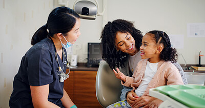 Buy stock photo Dentist, mother and child in consultation with discussion for oral hygiene, healthcare and wellness. Dental hygienist, mom and daughter in office with talk for medical help, orthodontics and advice.