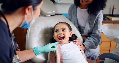 Buy stock photo Child, mouth and consultation with dentist in office for dental checkup, show cavity and extraction. Mother, kid and paediatric hygienist for oral health, teeth whitening and inspection for cleaning