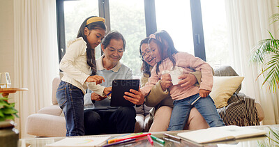 Buy stock photo Children, grandparents and tablet in lounge for online search, subscription service or bonding. Check film selection, streaming or senior people with girl to watch movie, family time and tech in home