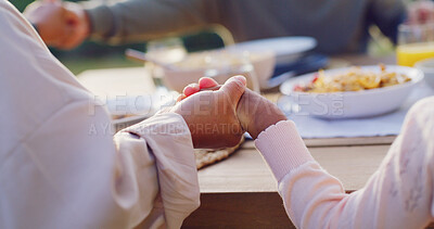 Buy stock photo Lunch, backyard and family holding hands by table to pray at celebration, gathering and festive dinner. Christmas, closeup and parents with child with faith, religion and grace for meal in holiday