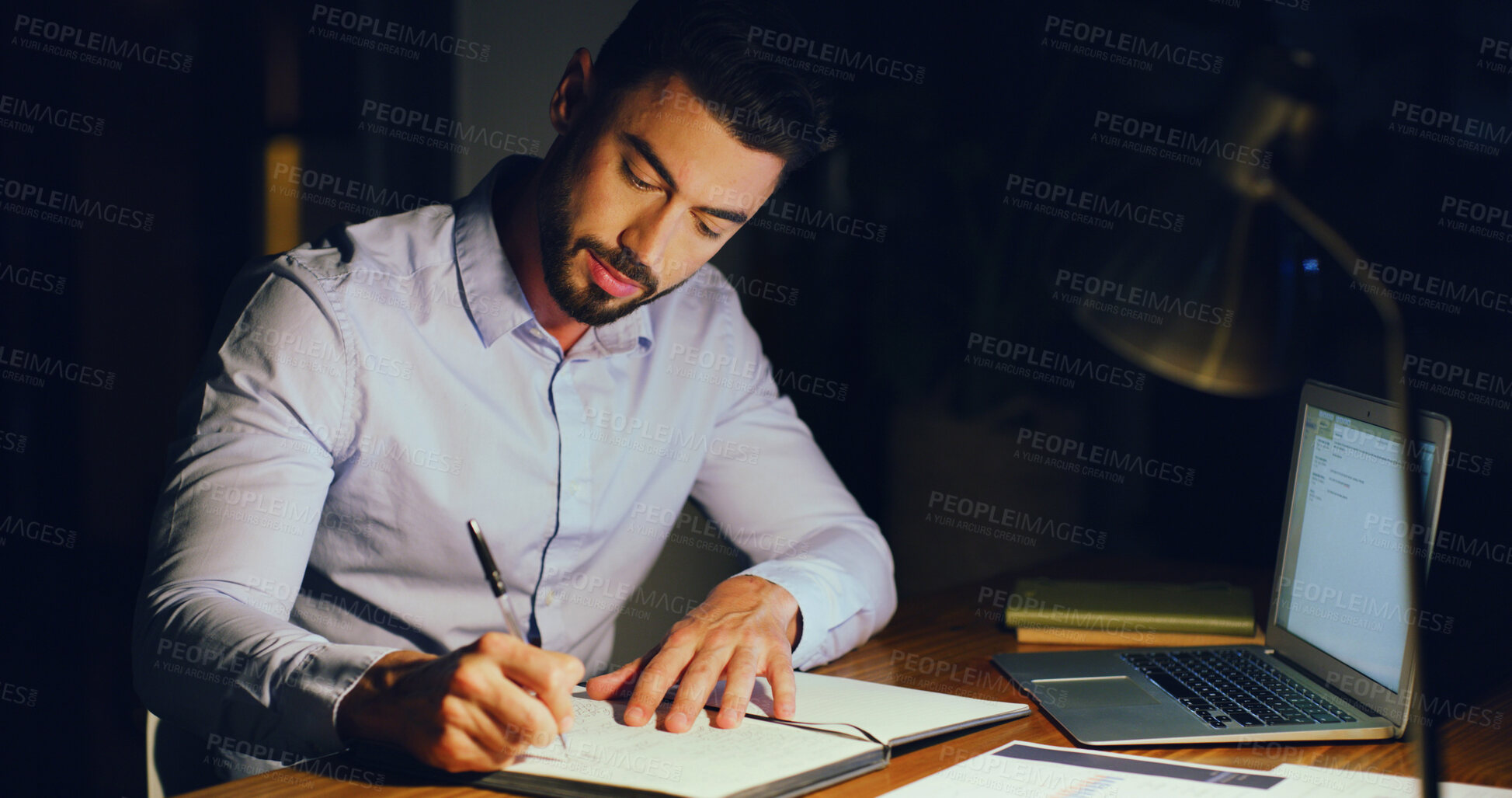 Buy stock photo Notebook, writing and businessman in office at night with research for finance report with budget. Planning, corporate career and male financial manager working on investment proposal with deadline.