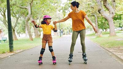 Buy stock photo Roller skating, holding hands and mom with child in nature on holiday, getaway or weekend trip with balance. Happy, safety and mother with kid in skates for hobby together outdoor in park on vacation