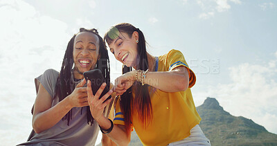 Buy stock photo Friends outdoor, laughing and scroll with phone for social media comedy, funny online chat or joke. Low angle, people and smile with tech in nature for internet humor, connection or bonding together.