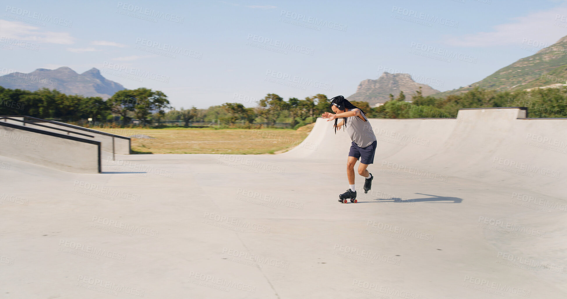 Buy stock photo Skate, park ramp and man with headphones on weekend, streaming music or balance practice. Outdoor hobby, audio tech and person with rollerskate for trick execution, mockup space or listening to radio