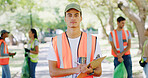 Man, clipboard and portrait at park for volunteering, checklist or registration form for cleaning trash. Person, leader and group with bag, garbage recycling or stop climate change for sustainability
