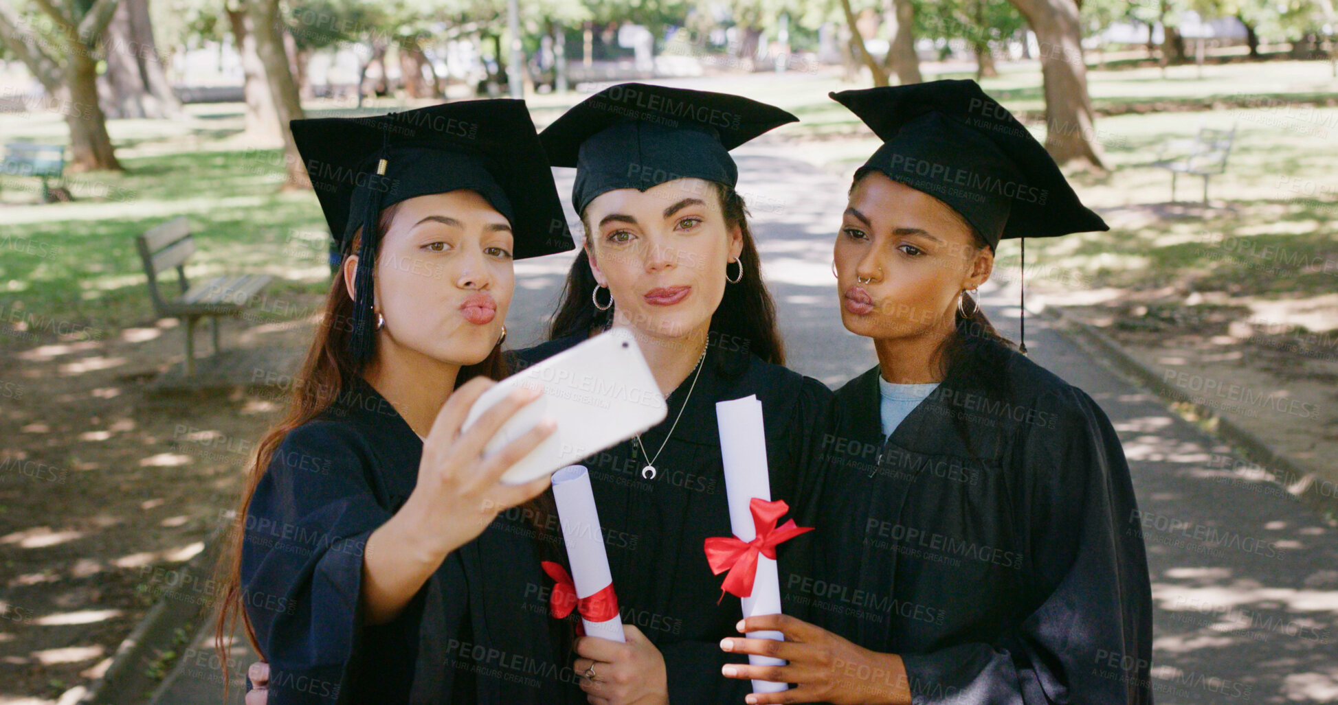 Buy stock photo Women, selfie and students at park for graduation, pout and certificate for education goals at campus. People, group and kiss emoji with photography, diploma or success with achievement at university