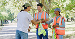 Group, people and volunteer in discussion at park for sign up with clipboard, planning or accountability. Team, men and women for talk, happy or safety vest with call to action for sustainability