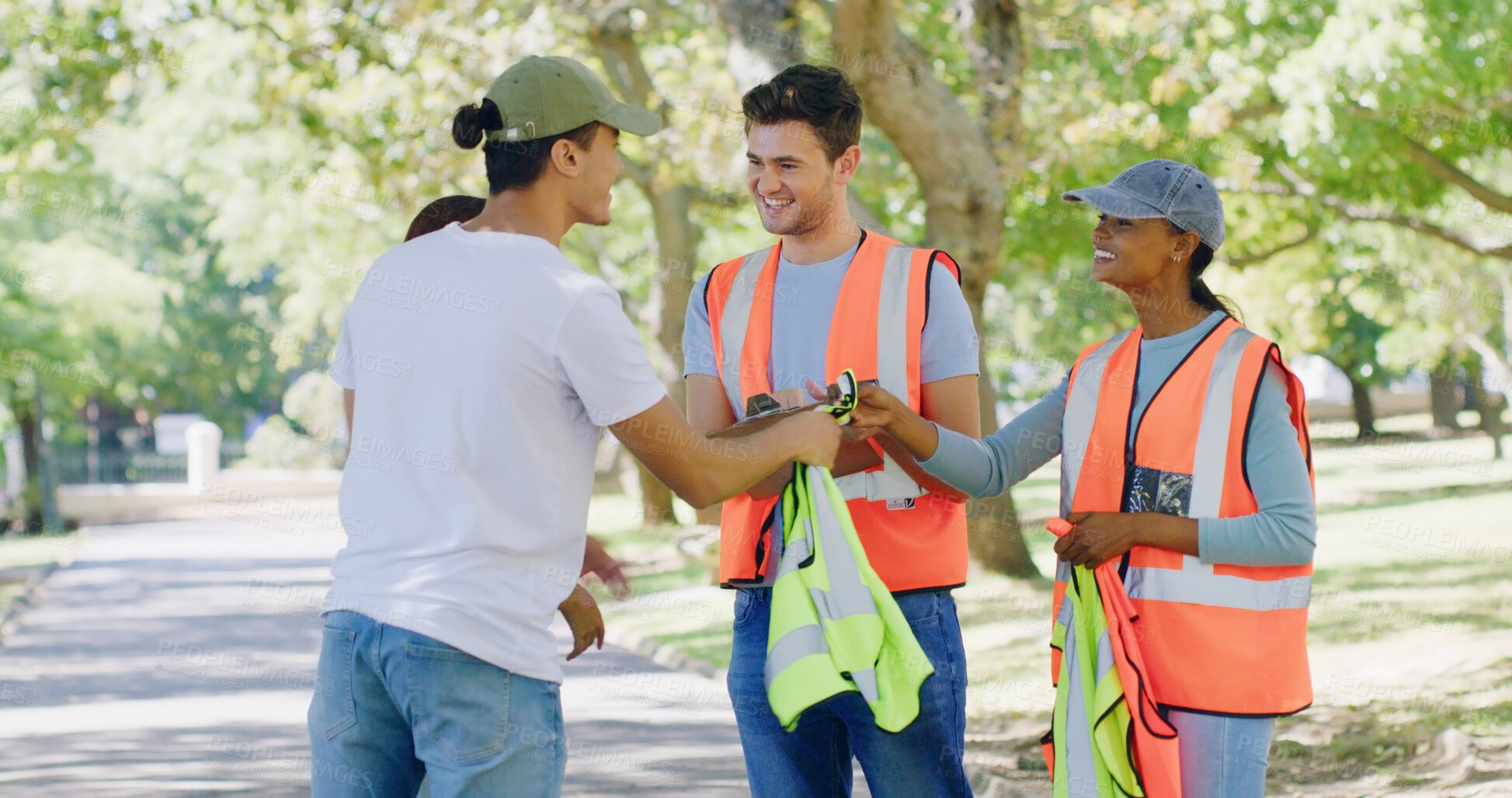 Buy stock photo Group, people and volunteer in discussion at park for sign up with clipboard, planning or accountability. Team, men and women for talk, happy or safety vest with call to action for sustainability