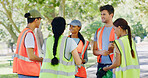 Team, people and volunteer in discussion at park for trash collection, planning or accountability. Group, men and women for talk, happy or call to action with social responsibility for sustainability