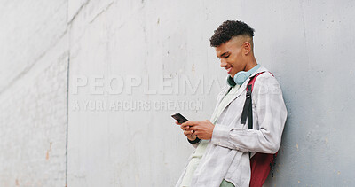 Buy stock photo Phone, mockup space and typing with teen boy in city for commute to high school destination. App, smile and text message with happy student outdoor in urban town for break, communication or education
