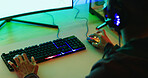 Hands, person and computer for gaming in home, entertainment and esports with RGB light. Keyboard, mouse and gamer play with headset for online competition, action or contest with match for gameplay