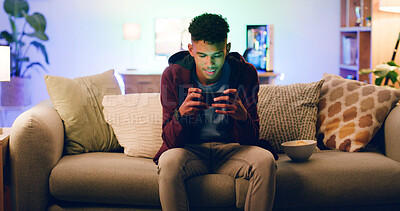 Buy stock photo Home, cellphone gaming and teenage boy on couch, contest and video streaming. Apartment, connection and player on sofa, smartphone and digital app for online score, entertainment and competition