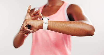 Buy stock photo Hands, smart watch and woman in studio, fitness and wellness on white background. Closeup, iot clock or person with training, monitor heart rate or digital app to track progress or stats for exercise