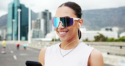 Buy stock photo Woman, runner and phone with earphones in town, bridge and break with audio subscription for training. Person, smartphone and sunglasses with mobile app, smile or streaming music with fitness in city
