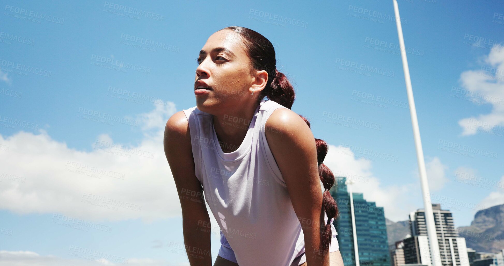 Buy stock photo Runner, fitness and woman in city for rest, recovery and break for exercise, workout or training. Sports, low angle and person with fatigue, tired and health in town for marathon, wellness or running