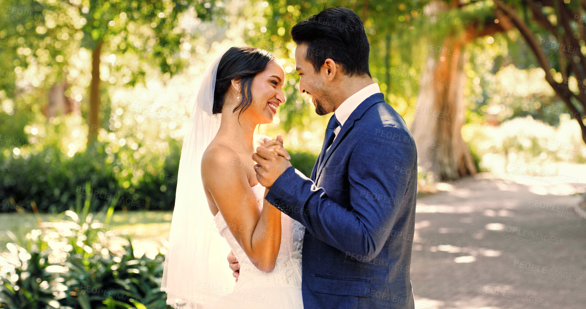 Buy stock photo Wedding, happy couple and love in nature with smile, support and celebration for bridal union or marriage. Bride, groom and people in park with dance for life partner, commitment or together outdoor