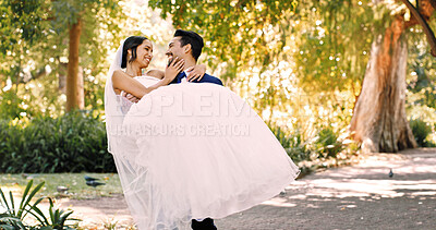 Buy stock photo Wedding, groom and carry bride at park for marriage celebration, relationship union and support. People, couple and lifting at ceremony in nature for love tradition, commitment and bonding together