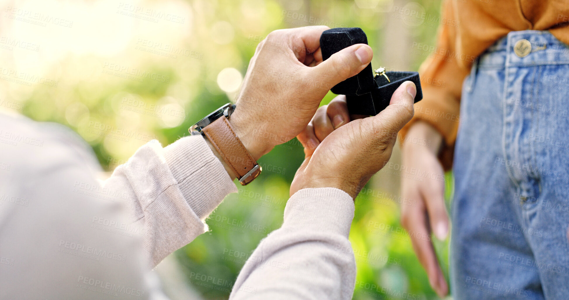 Buy stock photo Hands, couple and proposal with ring outdoor for marry me gesture, engagement and save the date. Bokeh, people and partner with diamond jewellery, marriage promise and relationship commitment at park