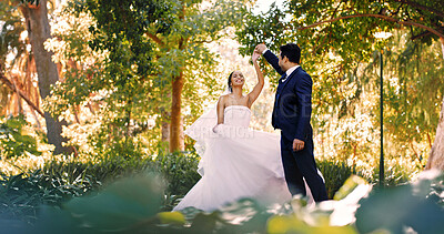 Buy stock photo Couple, wedding and dance at park, celebration and holding hands with smile, love and milestone. People, marriage and excited with commitment, relationship or happy outdoor with rhythm for event
