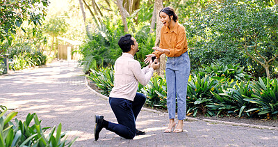 Buy stock photo Shocked, couple and proposal with ring at park for marry me gesture, engagement and save the date. Unexpected, people and partner with marriage promise, emotional reaction and relationship commitment