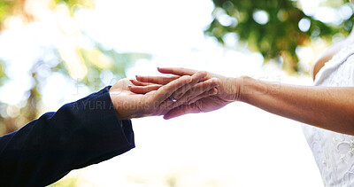Buy stock photo Wedding, below and couple in park holding hands for marriage, love and commitment for celebration. Affection, outdoor and bride and groom together for save the date, relationship and romantic event
