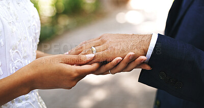 Buy stock photo Wedding ring, love and hands of couple in park for marriage, bonding and commitment for celebration. Affection, outdoor and bride and groom together for connection, relationship and romantic event