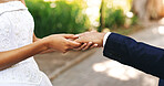 Wedding, closeup and couple in park holding hands for marriage, love and commitment for celebration. Affection, outdoor and bride and groom together for save the date, relationship and romantic event