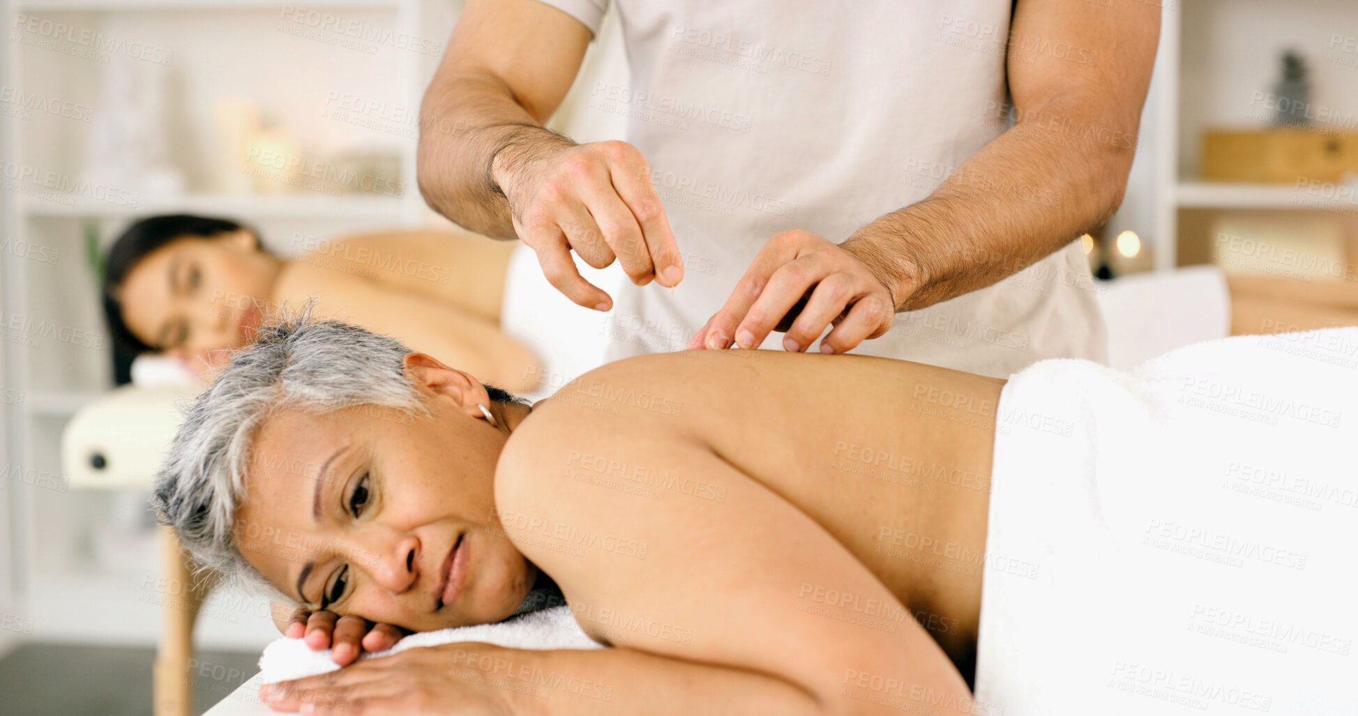 Buy stock photo Hands, mature woman and acupuncture needles at spa for back pain relief, muscle tension and healing. Acupuncturist, client and traditional chinese practice at wellness center for menopause and health