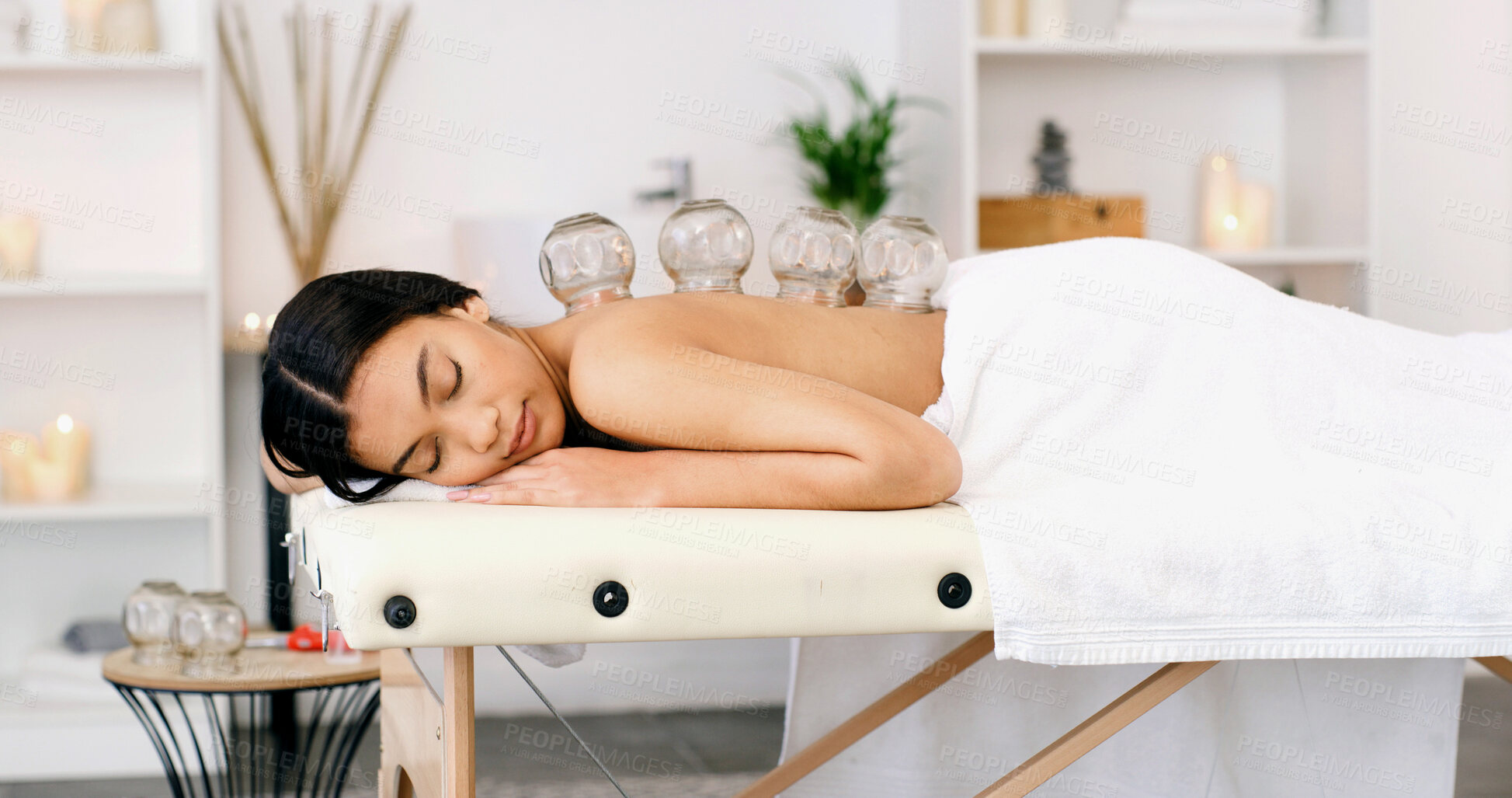 Buy stock photo Woman, relax or sleeping with cupping therapy for massage, healing or muscle tension in spa. Calm, female person or asleep with suction cups for stress relief or body treatment in beauty salon