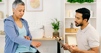 Buy stock photo Pain, clipboard and physiotherapy with senior woman for consulting, wellness and rehabilitation. Healthcare, writing and physical therapist with mature person for medical support, recovery and help