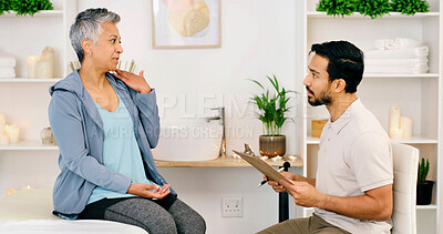 Buy stock photo Consultation, chiropractor and mature woman with injury on shoulder, wellness and health. Rehabilitation, physiotherapist and person with pain, medical help or assessment with clipboard in clinic