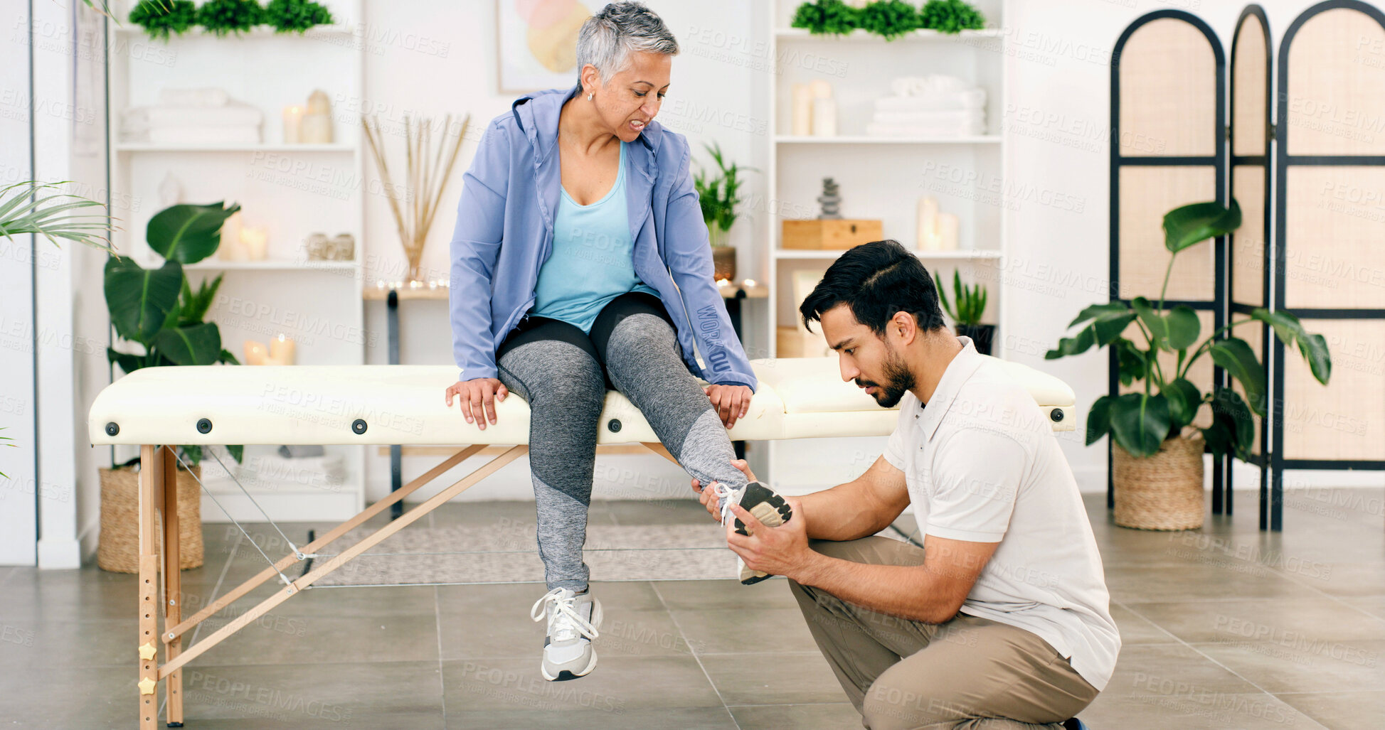 Buy stock photo Physiotherapy, foot exam or woman in clinic for consultation, help or service in rehabilitation. Healthcare, mature client or chiropractor in center with checkup, injury or visit for muscle recovery.