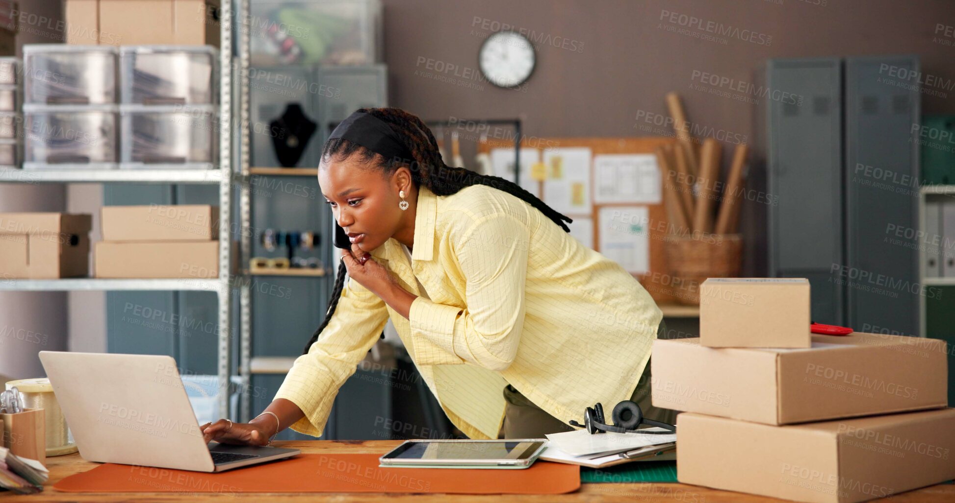 Buy stock photo Phone call, boxes and black woman with laptop in office for ecommerce order confirmation. Tracking delivery, inventory and parcel with person in small business for shipping and supply chain courier