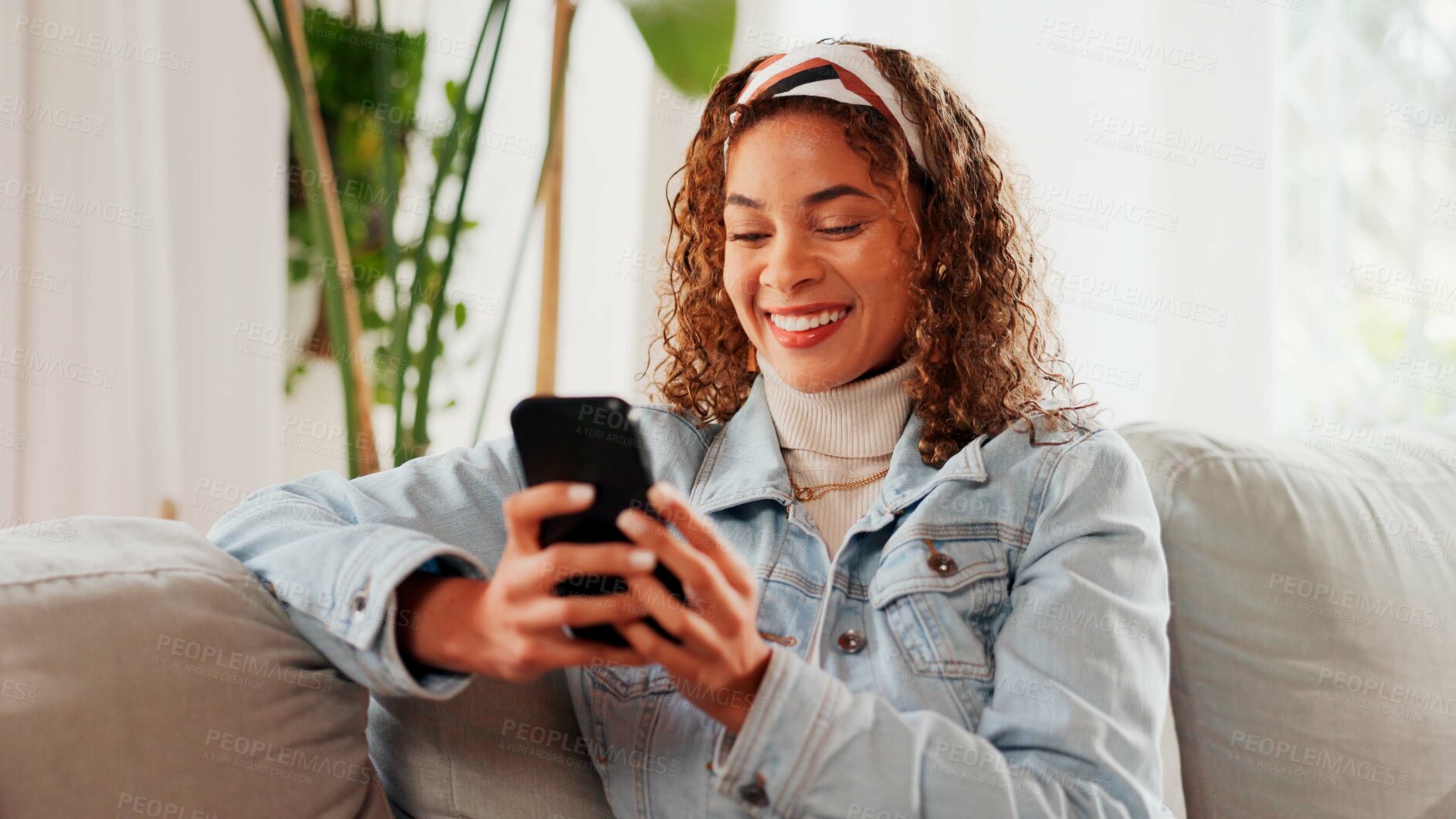 Buy stock photo Reading, smartphone and happy woman in home on sofa for blog post, social media profile and news. Mobile, relax and person in living room for communication with contact, notification and online chat