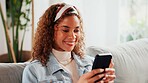 Smile, phone and woman in home on sofa for online dating, social media profile and post. Mobile, relax and African person in living room for communication with contact, typing text or romance match