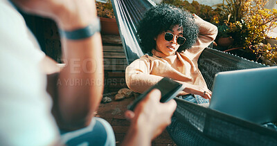 Buy stock photo Outdoor, sunglasses and woman on hammock with laptop, couple relax together and streaming film on weekend. Bonding, phone and people in backyard of home for social media, tech and watch movie