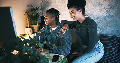 Buy stock photo Night, couple and laugh in home with computer for browsing internet, online meme and bonding together. Evening, African woman and man in house with desktop for website, social media and relationship.