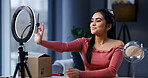Woman, influencer and phone with ring light at house for unboxing, product review and scroll for web chat. Girl, content creator and recording tech with package, mobile app or social network at home