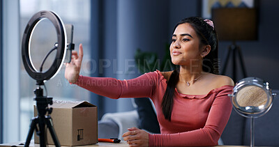 Buy stock photo Woman, influencer and phone with ring light at house for unboxing, product review and scroll for web chat. Girl, content creator and recording tech with package, mobile app or social network at home