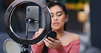 Ring light, phone and recording with influencer in home for makeup tutorial, video or advice on web show. Smartphone, woman and recording with cosmetics, beauty and tips with post on social media