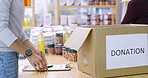 Food, donation and clipboard with hands of person for community service, humanitarian outreach and ngo project. Charity, grocery checklist and hunger relief with volunteer and box for non profit