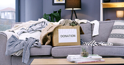 Buy stock photo Donation, empty and box with clothes on sofa in home for for charity, giveaway and welfare. Background, living room and mess for parcel, package and collection for clothing, garment or chaos in house